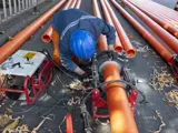 An engineering worker repairing a pipeline