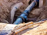 An excavated large water supply pipe